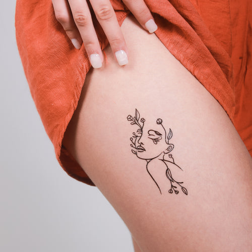 tatouage temporaire visage floral cuisse